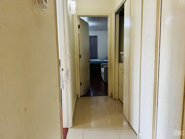 hallway featuring light tile patterned floors