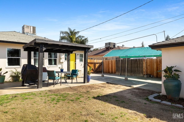 view of yard featuring a patio and central AC unit