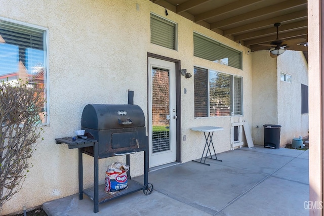 view of patio featuring a grill and ceiling fan