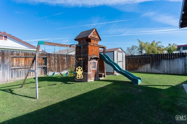 view of jungle gym with a fenced backyard and a yard