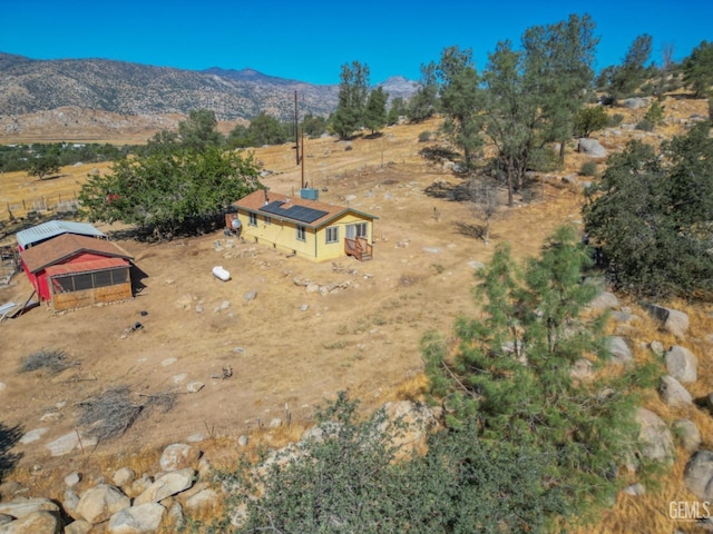 birds eye view of property with a mountain view