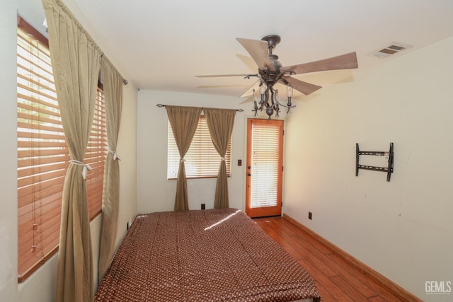 unfurnished room featuring ceiling fan, a healthy amount of sunlight, and light hardwood / wood-style flooring