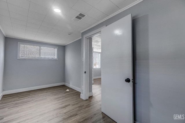 113 Lucard St, Taft, CA 93268 - spare room featuring healthy amount of natural light, baseboards, ornamental molding, and wood finished floors