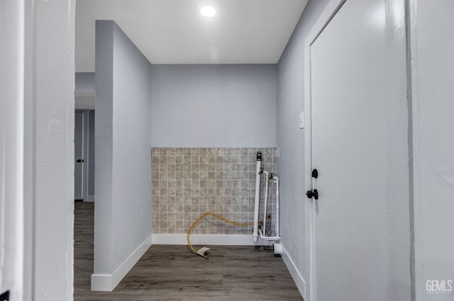 113 Lucard St, Taft, CA 93268 - clothes washing area with baseboards and wood finished floors
