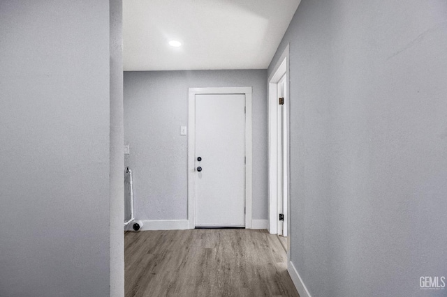 113 Lucard St, Taft, CA 93268 - corridor featuring baseboards and wood finished floors