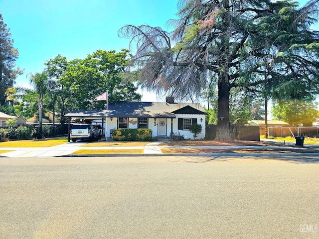 1806 Tulare St, Bakersfield, CA 93305 - view of front facade featuring driveway and an attached carport