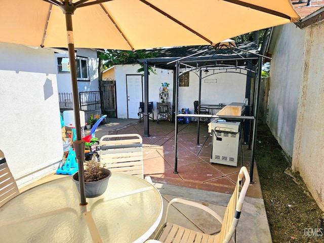 1806 Tulare St, Bakersfield, CA 93305 - view of patio featuring outdoor dining space and a gazebo