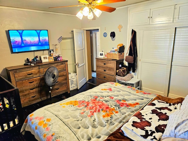 1806 Tulare St, Bakersfield, CA 93305 - bedroom with crown molding, ceiling fan, dark wood-style floors, and a closet