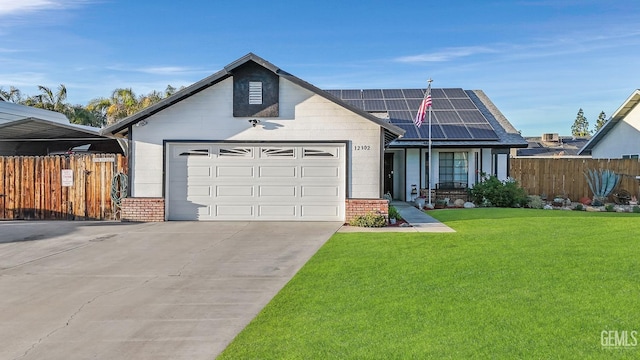 ranch-style house featuring driveway, a garage, fence, roof mounted solar panels, and a front lawn