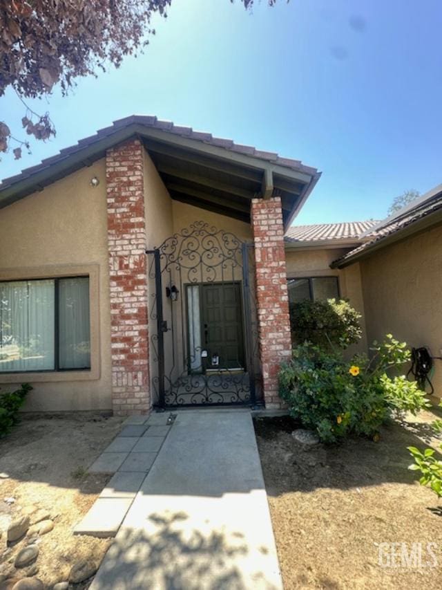 3105 Whisper Oak Way, Bakersfield, CA 93311 - property entrance with stucco siding