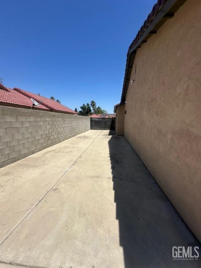 3105 Whisper Oak Way, Bakersfield, CA 93311 - fenced backyard with a patio area