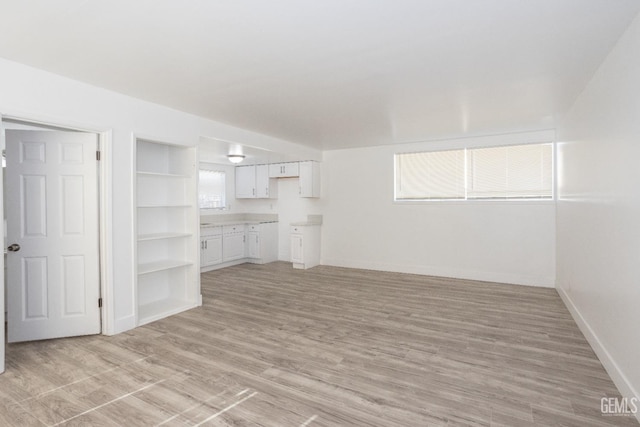 unfurnished living room featuring light hardwood / wood-style floors