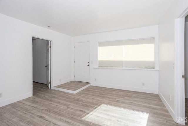 spare room featuring light hardwood / wood-style flooring