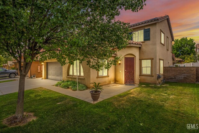 10114 Oporto Way, Bakersfield, CA 93306 - view of front of home featuring stucco siding, driveway, a garage, and a tiled roof
