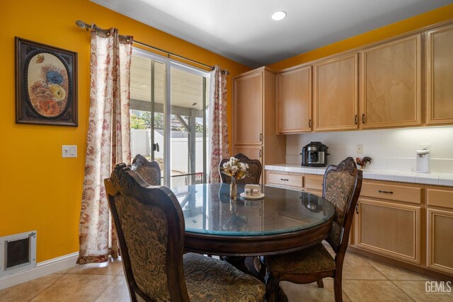 10114 Oporto Way, Bakersfield, CA 93306 - dining area with light tile patterned flooring and baseboards