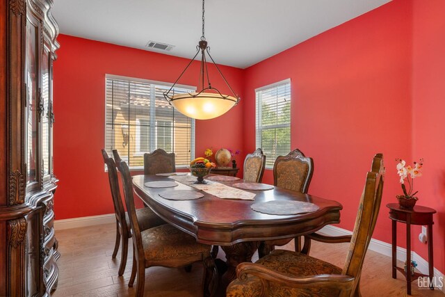 10114 Oporto Way, Bakersfield, CA 93306 - dining area featuring healthy amount of natural light, baseboards, and light wood-style flooring