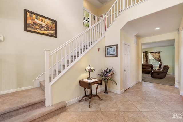 10114 Oporto Way, Bakersfield, CA 93306 - stairs with baseboards, recessed lighting, tile patterned floors, and carpet