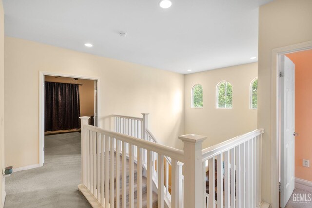 10114 Oporto Way, Bakersfield, CA 93306 - hall with an upstairs landing, carpet, recessed lighting, and baseboards