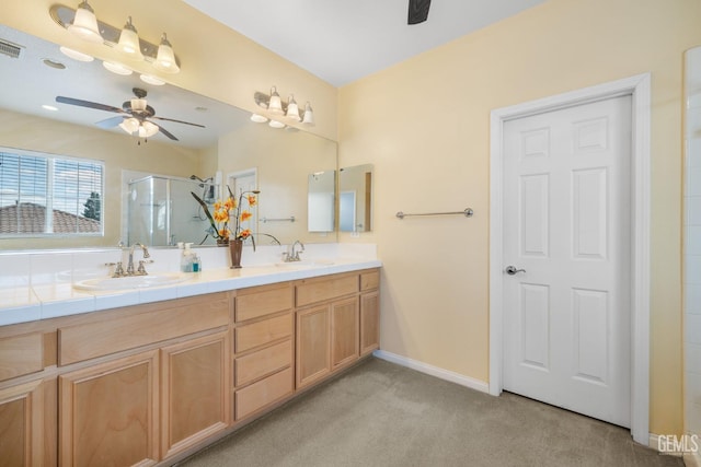10114 Oporto Way, Bakersfield, CA 93306 - bathroom featuring a ceiling fan, a shower stall, double vanity, baseboards, and carpet floors