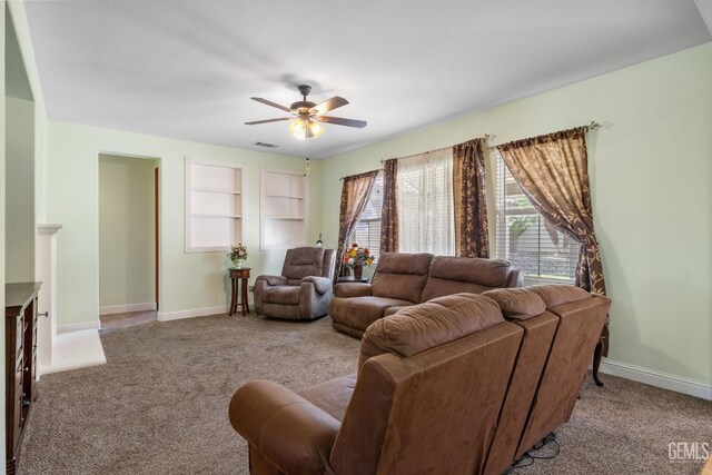 10114 Oporto Way, Bakersfield, CA 93306 - carpeted living area with ceiling fan, baseboards, and built in shelves