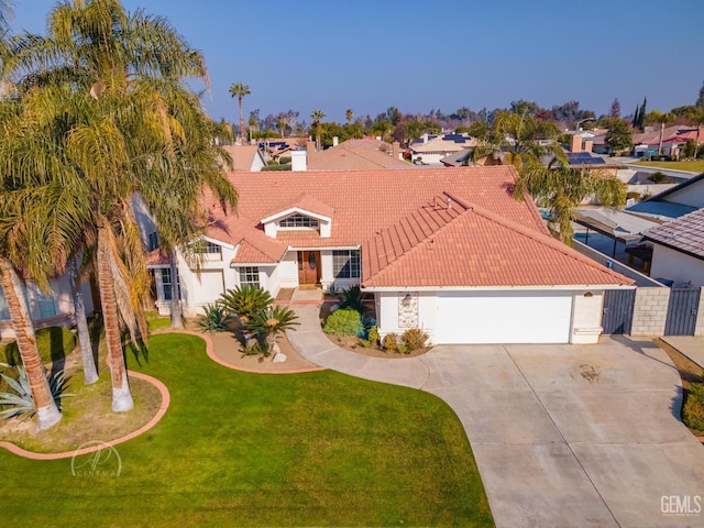 mediterranean / spanish house with a front lawn