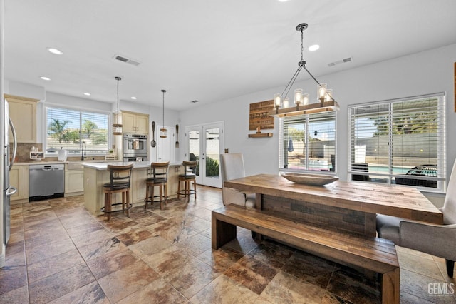 dining room with a wealth of natural light and french doors