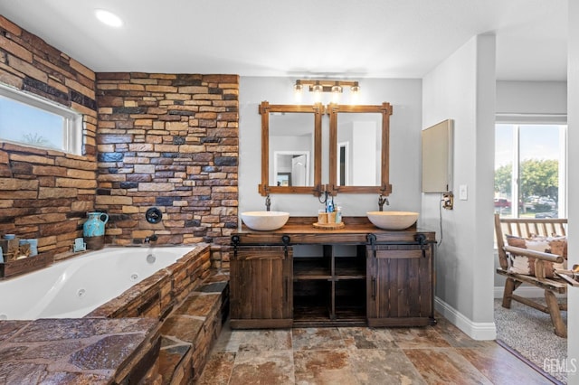 bathroom with vanity and a bathtub