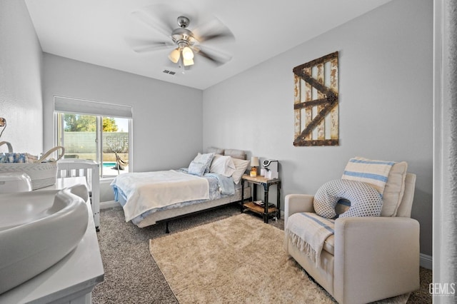 carpeted bedroom with ceiling fan