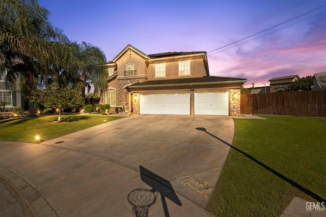 view of property featuring a garage and a yard