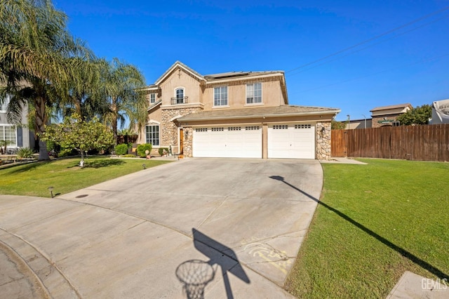 view of front property featuring a garage, a front yard, and solar panels