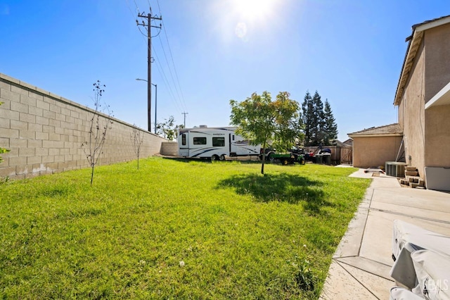 view of yard featuring a patio area and cooling unit