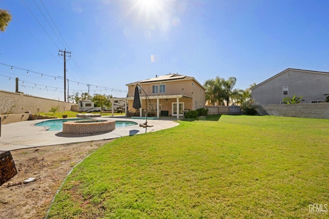 view of yard featuring a patio area and a pool with hot tub