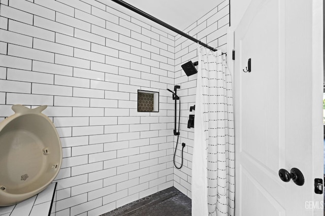 bathroom with a shower with curtain