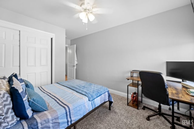 carpeted bedroom featuring ceiling fan and a closet