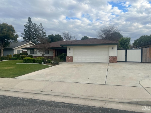 view of front of property with a garage and a front yard