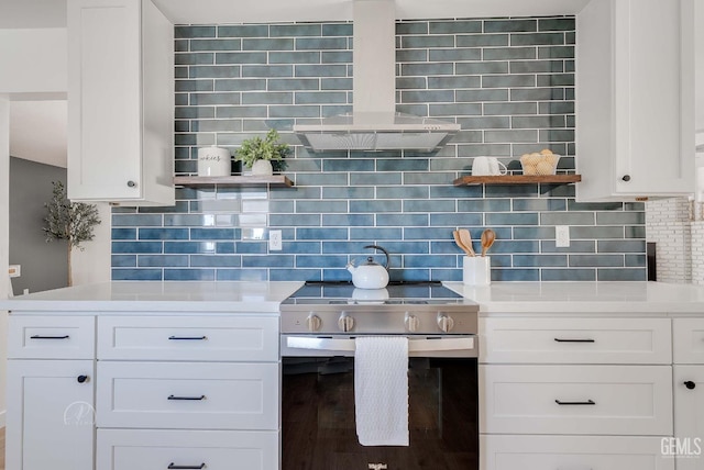 3700 Christmas Tree Ln, Bakersfield, CA 93306 - kitchen with stainless steel electric range oven, decorative backsplash, light countertops, and white cabinetry