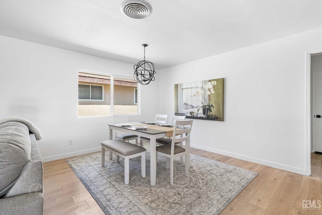3700 Christmas Tree Ln, Bakersfield, CA 93306 - dining area with a chandelier and light wood-style floors