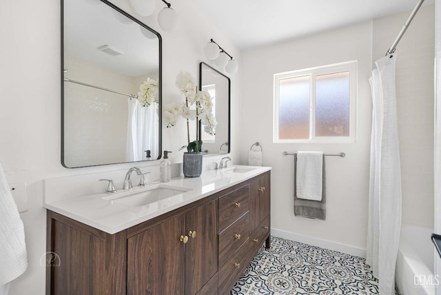 3700 Christmas Tree Ln, Bakersfield, CA 93306 - bathroom with double vanity, shower / bath combo with shower curtain, and tile patterned floors