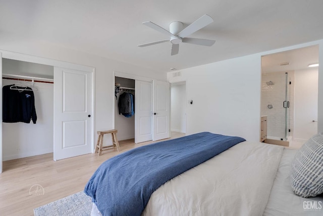 3700 Christmas Tree Ln, Bakersfield, CA 93306 - bedroom featuring light wood-style flooring, multiple closets, ensuite bath, and ceiling fan