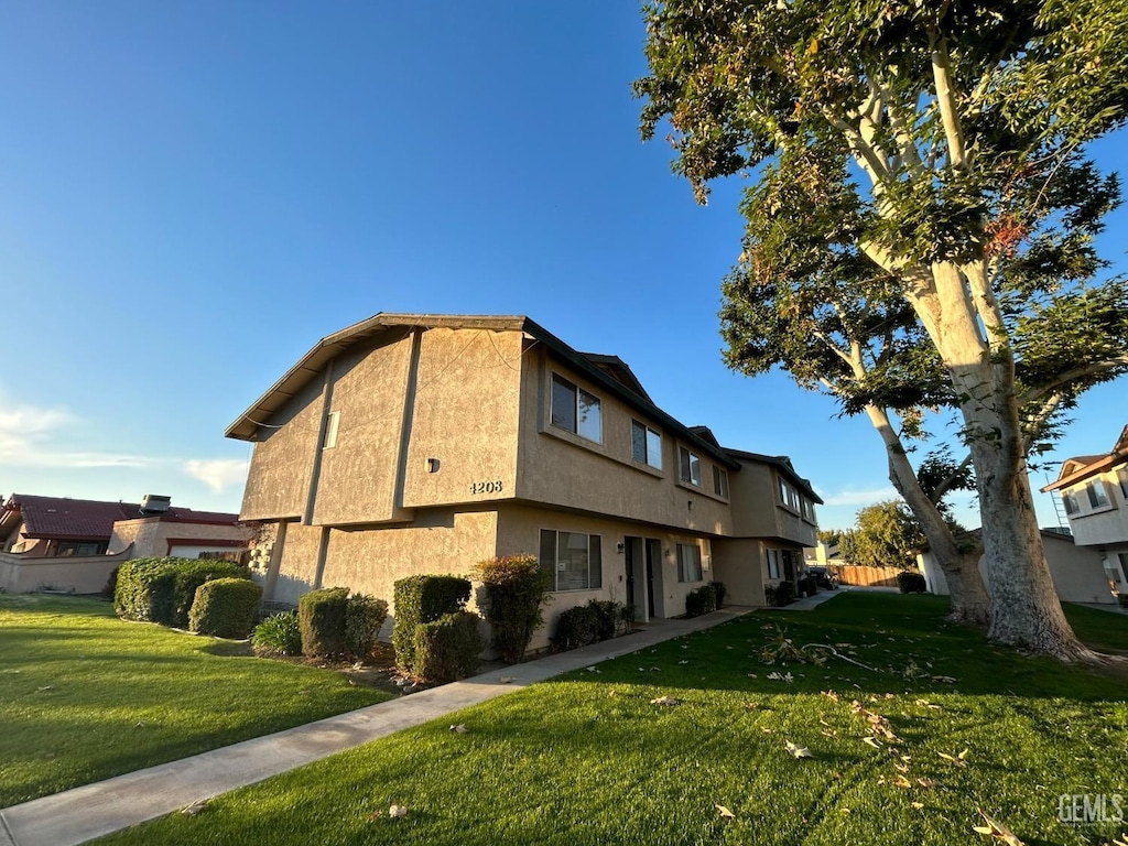 view of building exterior featuring fence