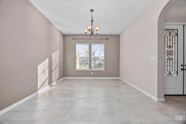 unfurnished dining area featuring light tile patterned floors and a chandelier