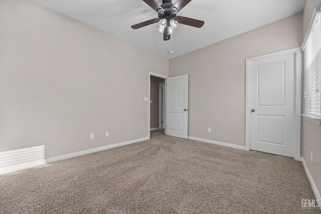 unfurnished bedroom featuring ceiling fan and carpet flooring