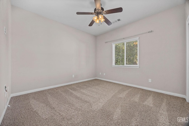 carpeted empty room featuring ceiling fan