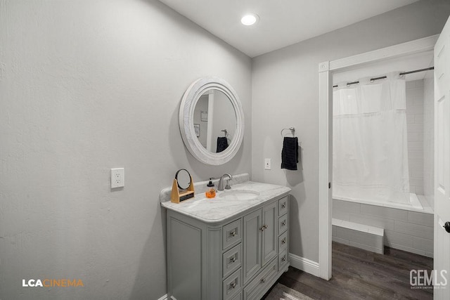 4620 Taft Hwy, Bakersfield, CA 93313 - bathroom featuring vanity, wood finished floors, tiled shower / bath, and recessed lighting
