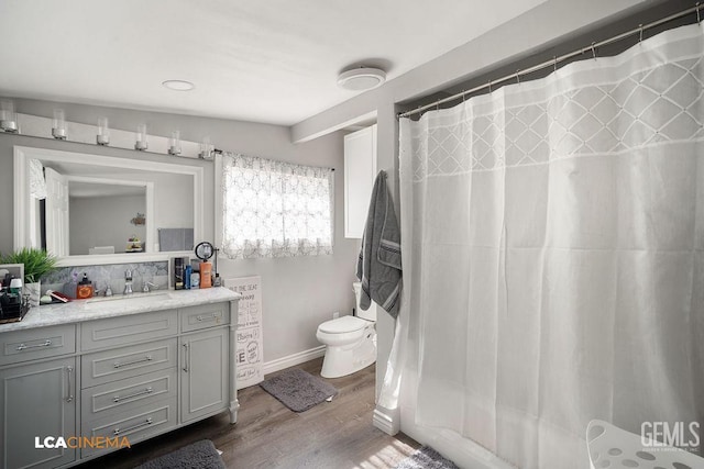 4620 Taft Hwy, Bakersfield, CA 93313 - bathroom with vanity, wood finished floors, and a shower with curtain