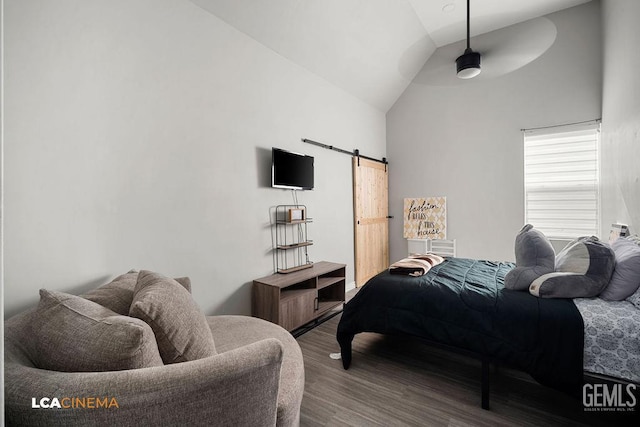 4620 Taft Hwy, Bakersfield, CA 93313 - bedroom with wood finished floors, a barn door, lofted ceiling, and a ceiling fan