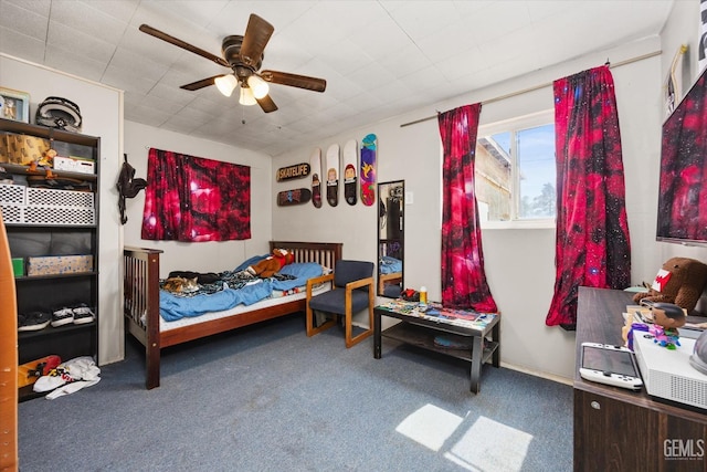 carpeted bedroom with a ceiling fan