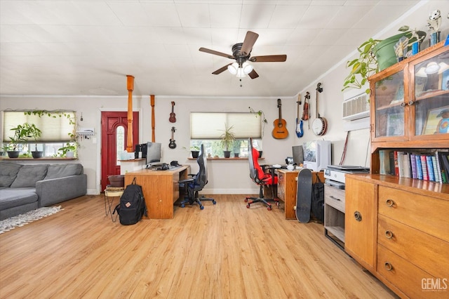 home office featuring baseboards, ceiling fan, and light wood-type flooring