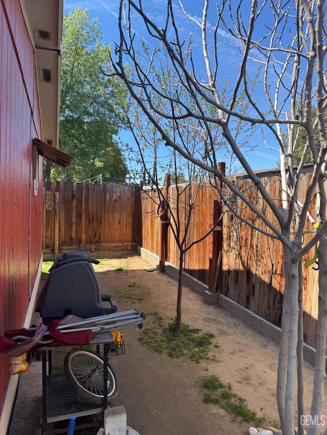 view of yard with a fenced backyard