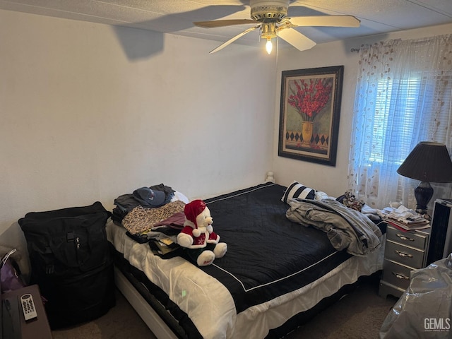 bedroom with carpet floors and a ceiling fan